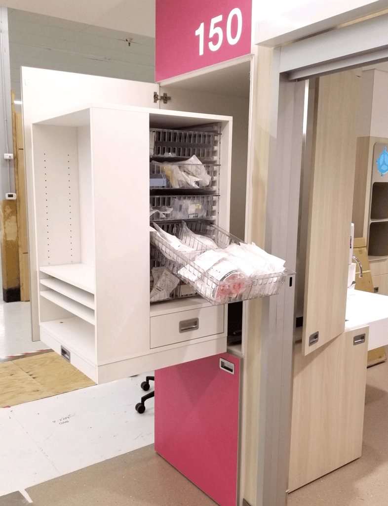 Pull-out Nurse server, pulled out to show interior storage and drop drawers
